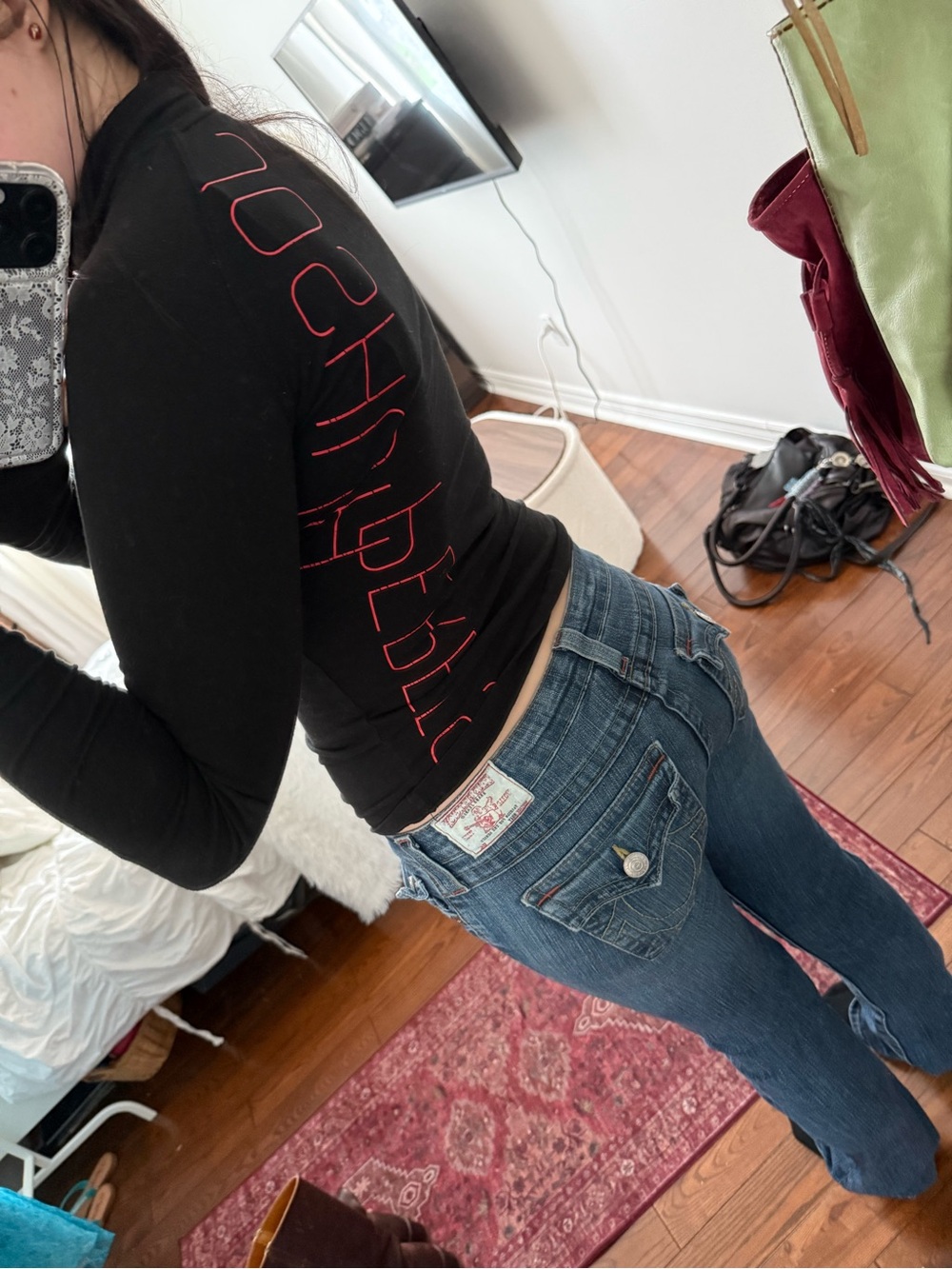 Joshua Perets black long sleeve top with red lettering 🐈‍⬛